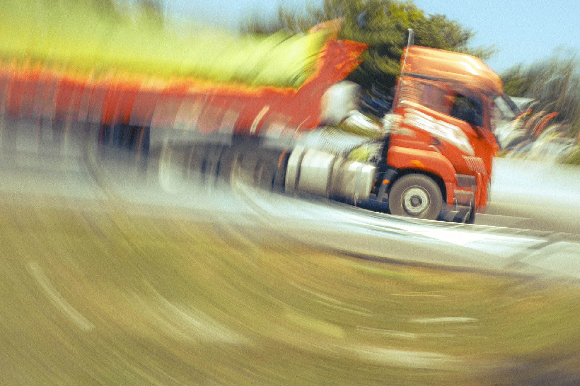 Semi truck at speed on a highway with motion blur